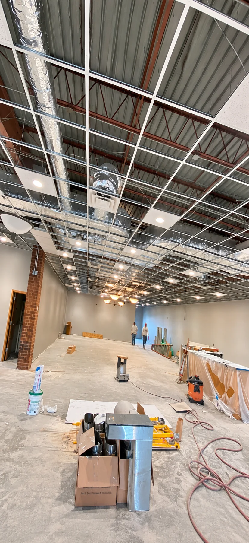 Suspended acoustical ceiling grid installation