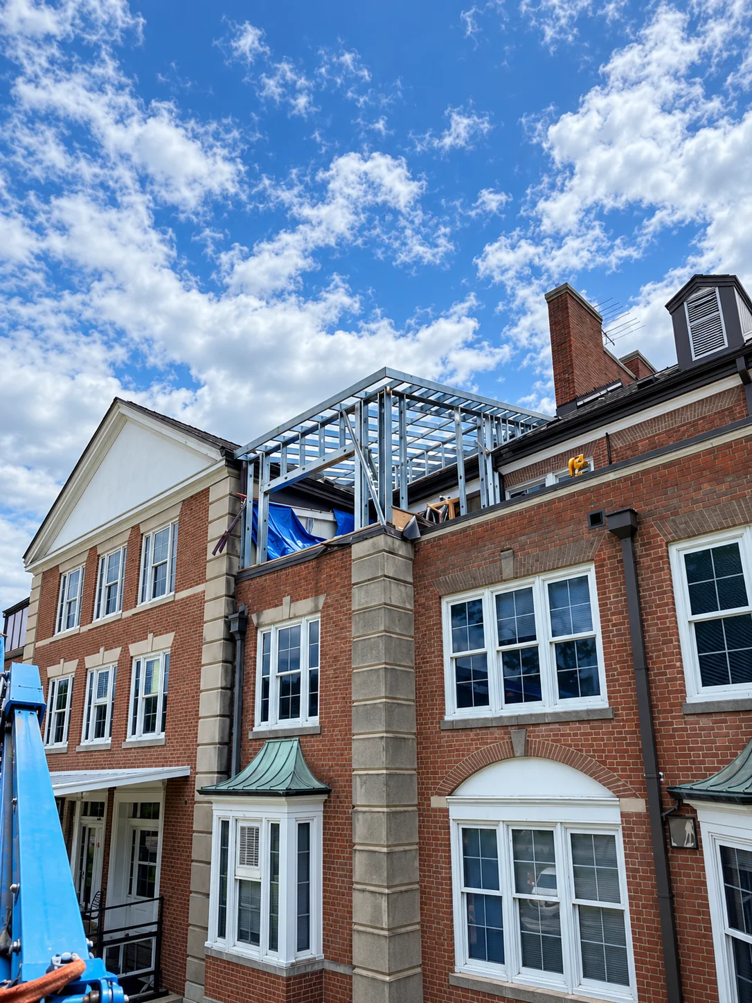 Rooftop metal framing on a brick building