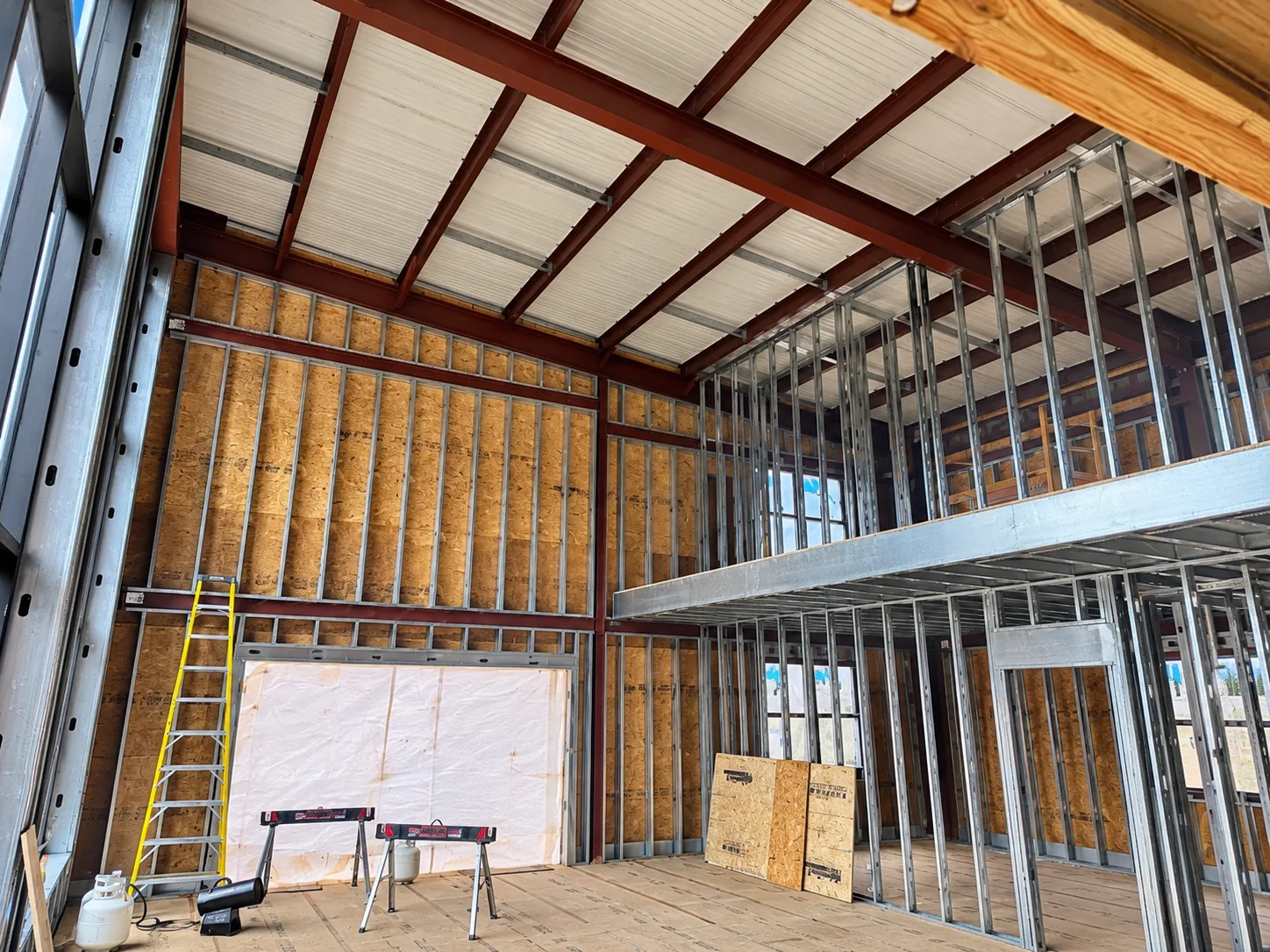 Two-story metal stud framing and mezzanine