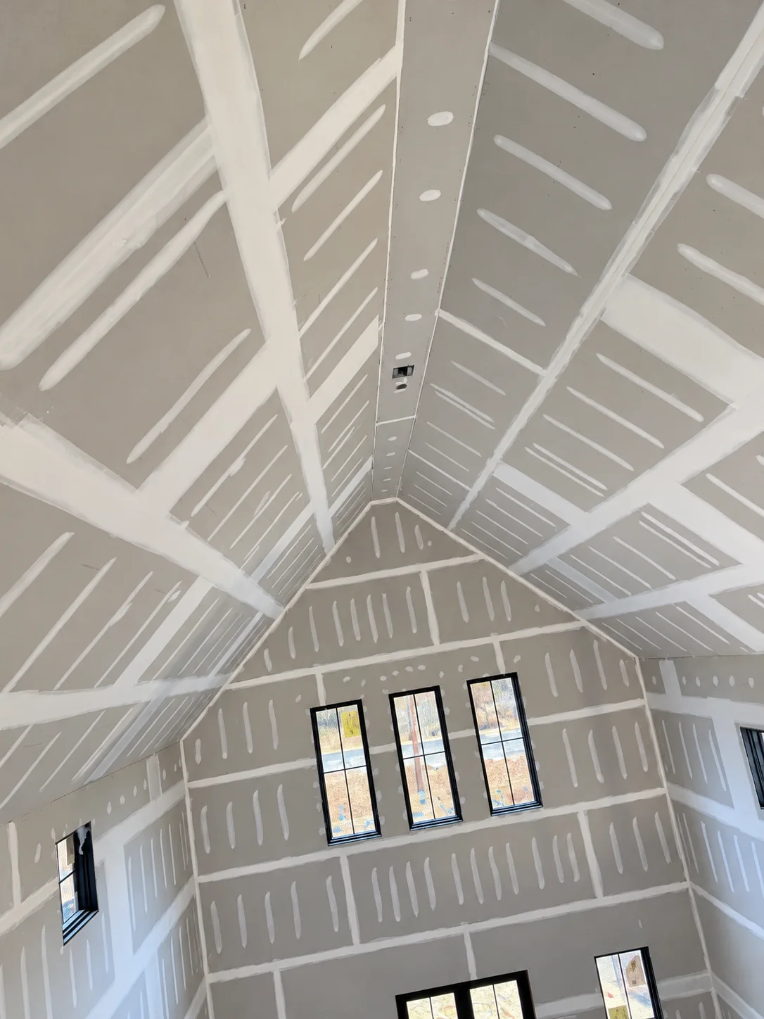 Taped drywall on a vaulted ceiling