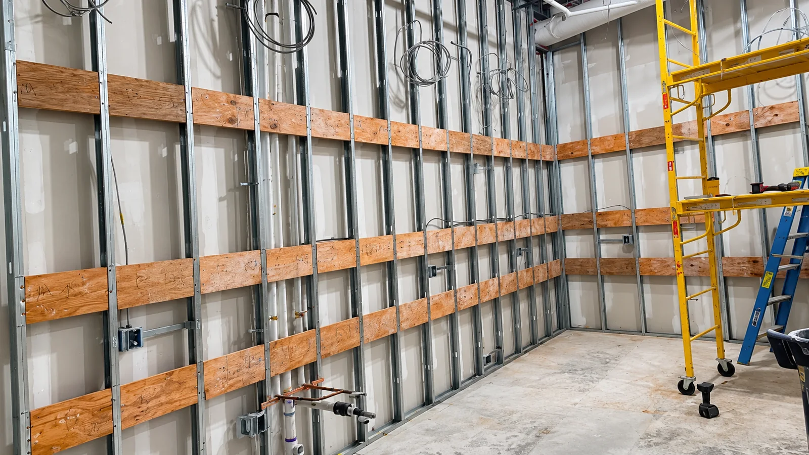 Metal stud framing with wood backing for fixtures